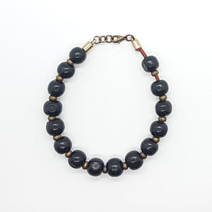 Pulsera bolitas de madera y zamak